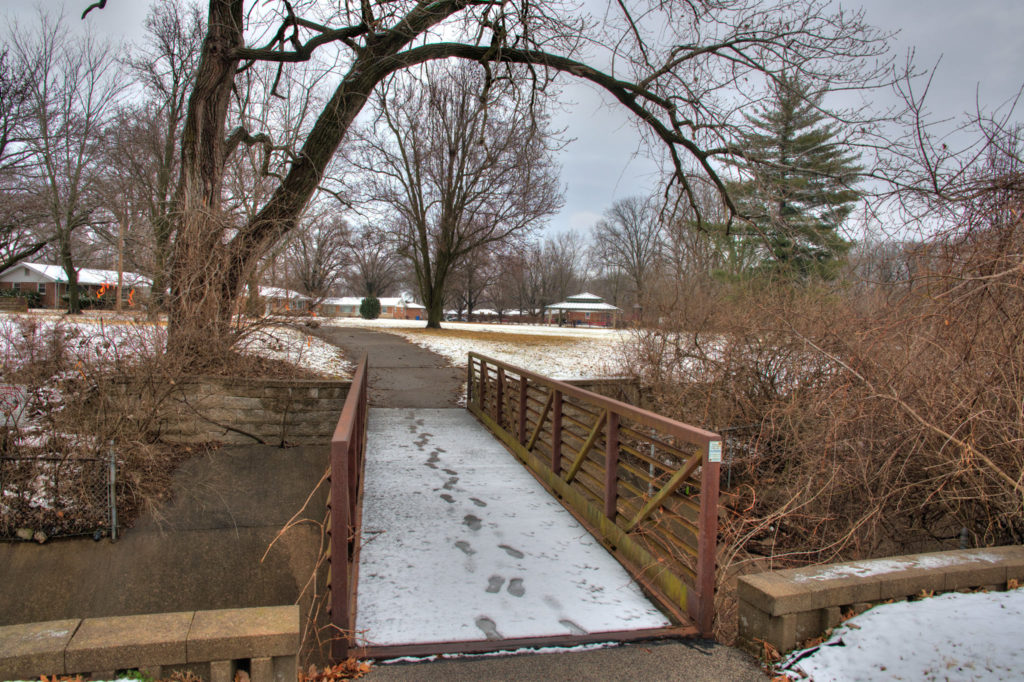 Bridge with snow and footprints.